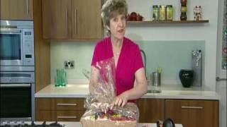 Wrapping a hamper using cellophane wrap [upl. by Ibur]